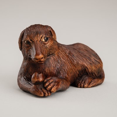 Lot 483 - NIKITA STRUKOV: A WOOD NETSUKE OF A DOG