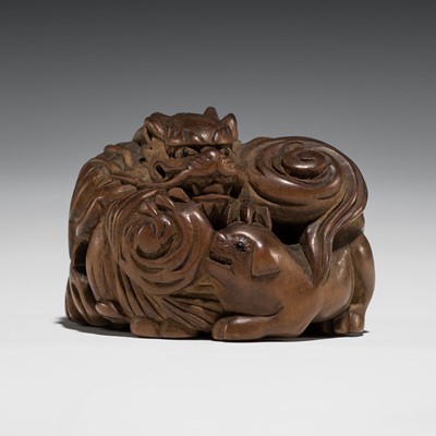 Lot 340 - MASAYOSHI: A RARE WOOD NETSUKE OF A DRAGON AND PUPPY