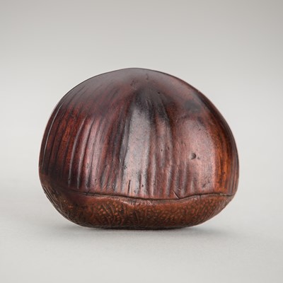 Lot 390 - TADATOSHI: A FINE NAGOYA SCHOOL WOOD NETSUKE OF A FLATTENED CHESTNUT