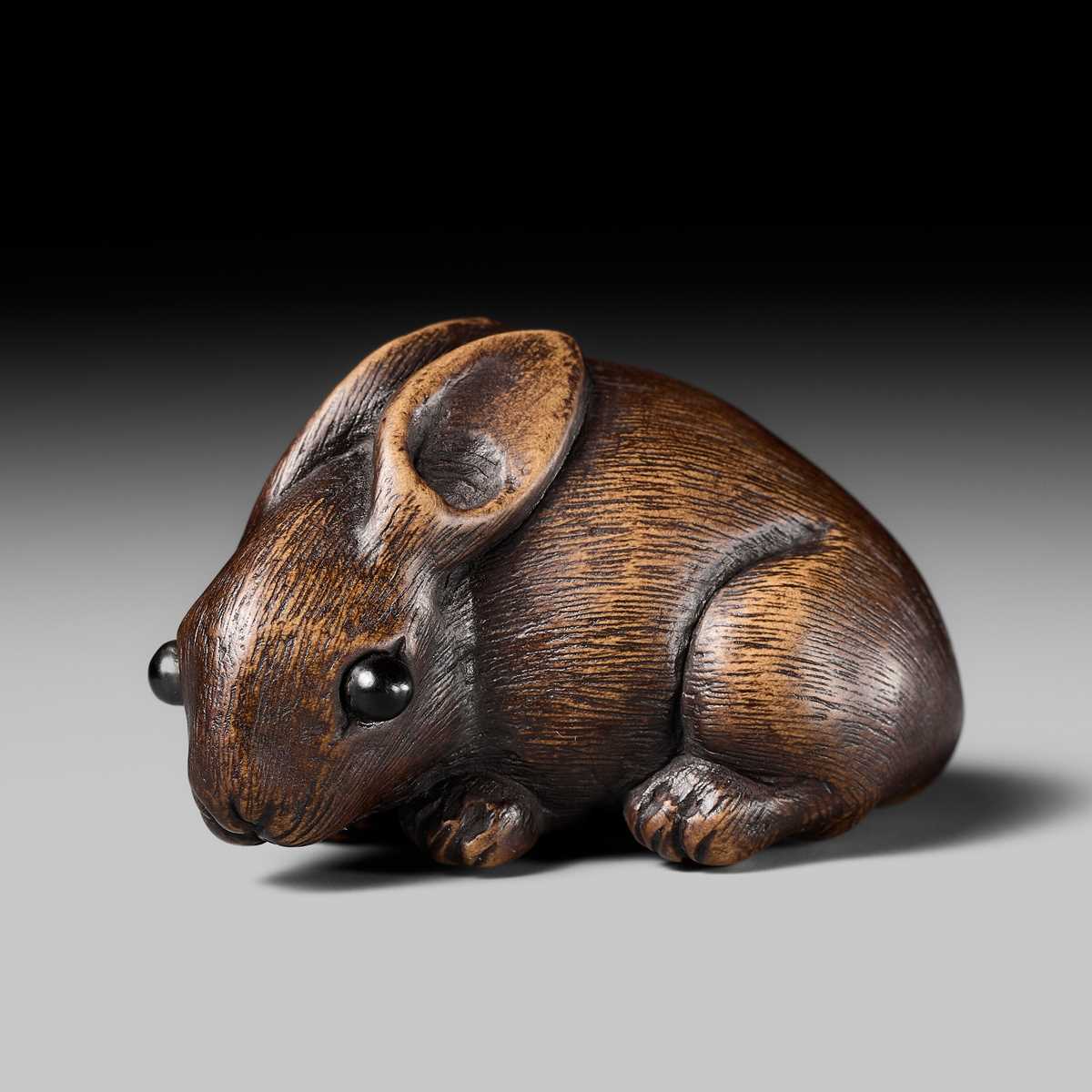 Lot 178 - HIDARI ISSAN: A FINE WOOD NETSUKE OF A HARE