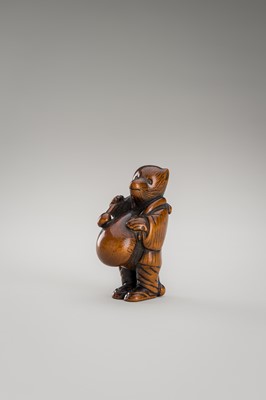 Lot 460 - AN AMUSING WOOD NETSUKE OF A DISGUISED TANUKI