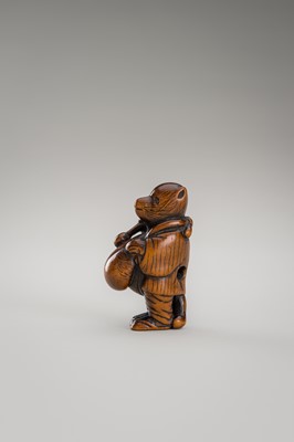 Lot 460 - AN AMUSING WOOD NETSUKE OF A DISGUISED TANUKI