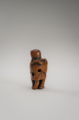Lot 460 - AN AMUSING WOOD NETSUKE OF A DISGUISED TANUKI