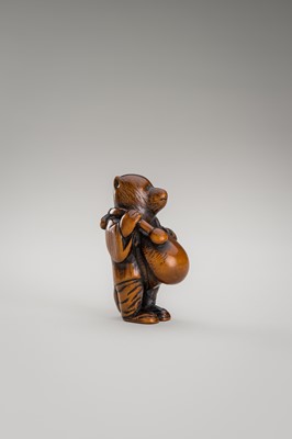 Lot 460 - AN AMUSING WOOD NETSUKE OF A DISGUISED TANUKI