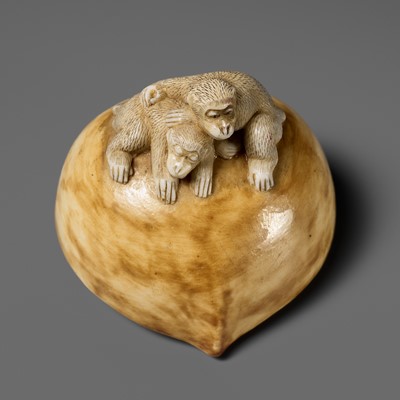 Lot 362 - A RARE PORCELAIN (YAKIMONO) NETSUKE OF TWO MONKEYS RESTING ON A CHESTNUT