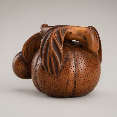 Lot 1360 - YOSHIKIYO: AN ANABORI WOOD NETSUKE OF A MIKAN