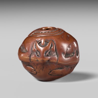 Lot 428 - HIDARI ISSAN: A FINE KURUMI (WALNUT) OJIME OF A TANUKI KETTLE (BUNBUKU CHAGAMA)