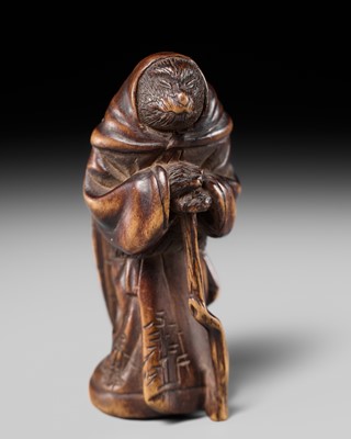 Lot 177 - A FINE NAGOYA SCHOOL WOOD NETSUKE OF A DISGUISED KITSUNE