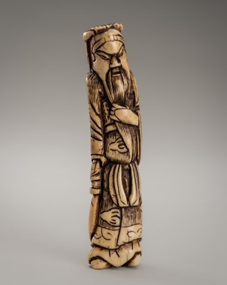 Lot 426 - AN ANTLER NETSUKE OF KAN’U