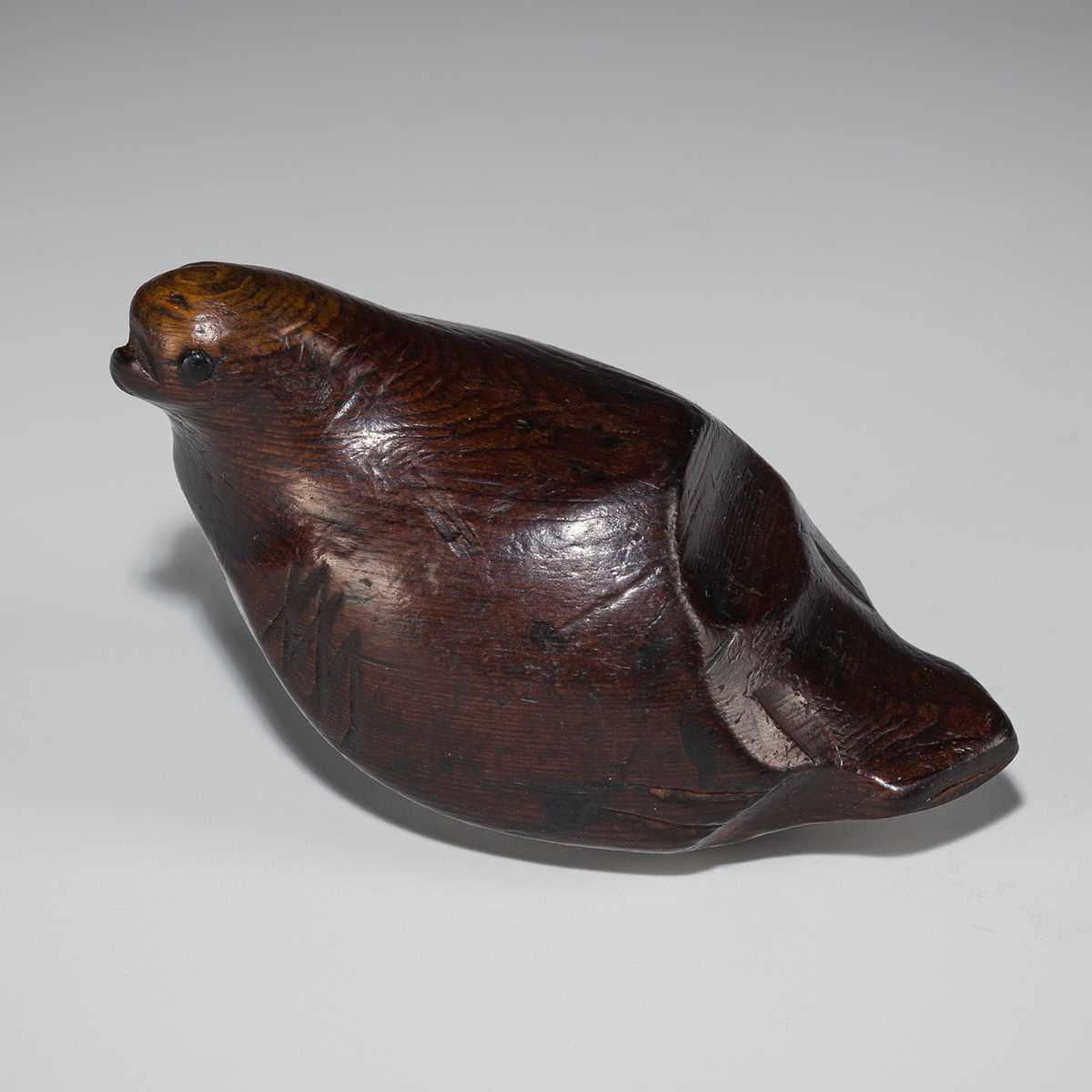 Lot 186 - SUKENAGA: A RARE ITTOBORI YEW WOOD NETSUKE OF A PIGEON