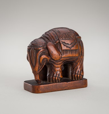 Lot 1330 - A WOOD NETSUKE OF A CAPARISONED ELEPHANT