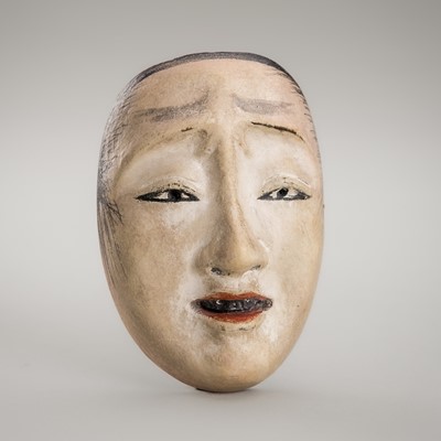 Lot 1430 - A LACQUERED WOOD NETSUKE OF A NOH MASK, KO-OMOTE