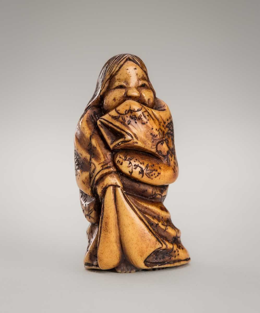 Lot 364 - MITSUHIRO: AN ANTLER NETSUKE OF OKAME