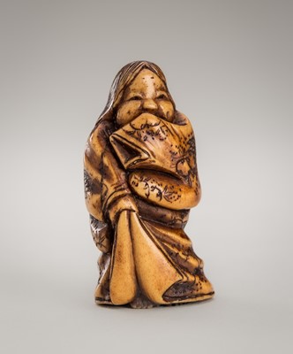 Lot 320 - MITSUHIRO: AN ANTLER NETSUKE OF OKAME