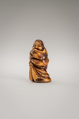 Lot 364 - MITSUHIRO: AN ANTLER NETSUKE OF OKAME