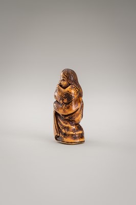 Lot 364 - MITSUHIRO: AN ANTLER NETSUKE OF OKAME