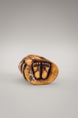 Lot 364 - MITSUHIRO: AN ANTLER NETSUKE OF OKAME