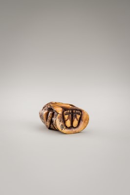 Lot 364 - MITSUHIRO: AN ANTLER NETSUKE OF OKAME