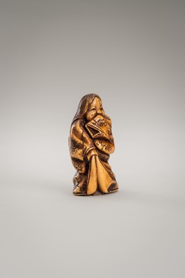 Lot 364 - MITSUHIRO: AN ANTLER NETSUKE OF OKAME