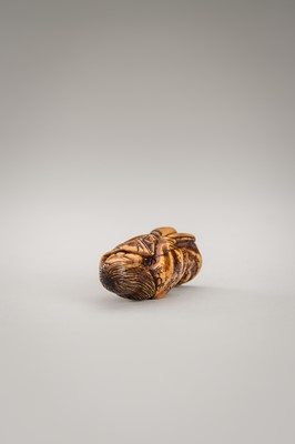 Lot 364 - MITSUHIRO: AN ANTLER NETSUKE OF OKAME