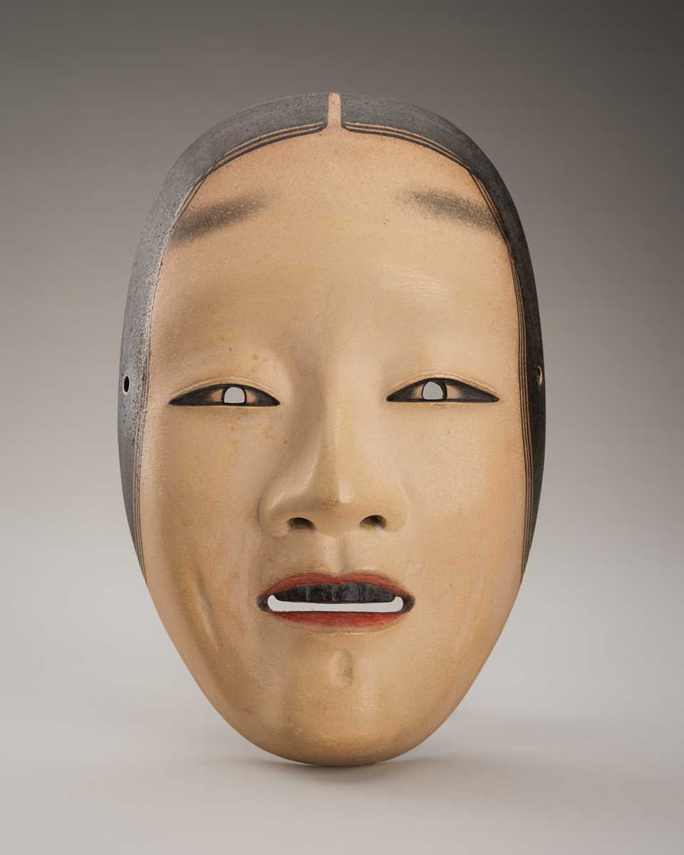 Lot 89 - A LACQUERED WOOD NOH MASK OF AN ONNA