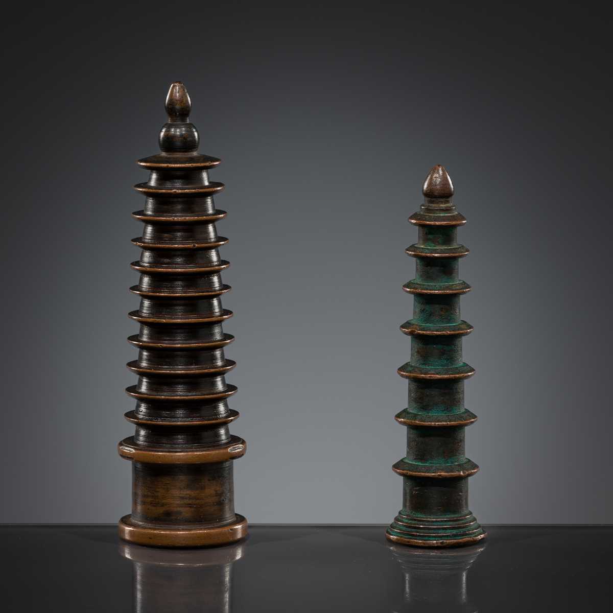 Lot 1105 - TWO COPPER-ALLOY STUPA ‘PARASOL’ FINIALS, 18TH-19TH CENTURY OR EARLIER