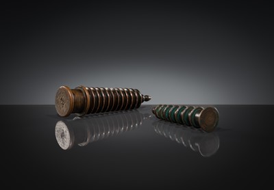 Lot 1105 - TWO COPPER-ALLOY STUPA ‘PARASOL’ FINIALS, 18TH-19TH CENTURY OR EARLIER