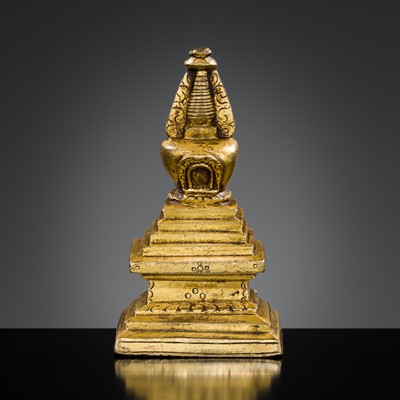 Lot 300 - A SMALL GILT BRONZE STUPA, TIBET, 18TH CENTURY