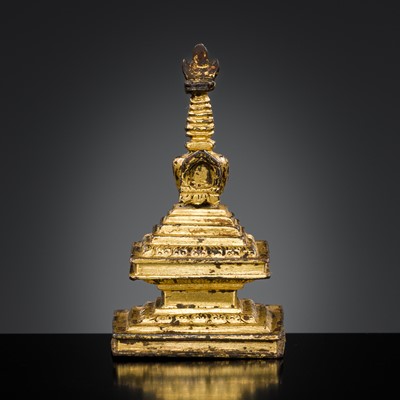 Lot 301 - A RARE TIBETAN GILT BRONZE MINIATURE STUPA, 18TH CENTURY