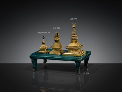 Lot 301 - A RARE TIBETAN GILT BRONZE MINIATURE STUPA, 18TH CENTURY