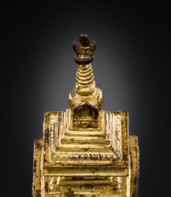 Lot 301 - A RARE TIBETAN GILT BRONZE MINIATURE STUPA, 18TH CENTURY