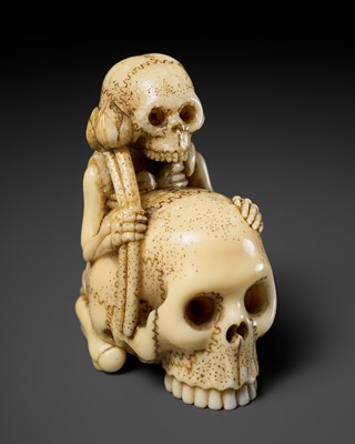 Lot 254 - TOMONOBU: A WALRUS TUSK NETSUKE OF A SKELETON