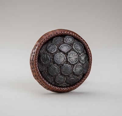 Lot 1329 - A SIGNED WOOD KAGAMIBUTA NETSUKE OF A FILLED BASKET