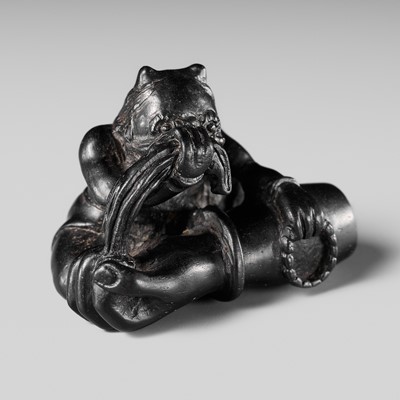 Lot 514 - KOGETSU: A FINE EBONY WOOD NETSUKE OF AN ONI LAMENTING THE SEVERED ARM OF THE DEMON RASHOMON