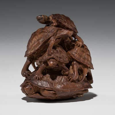 Lot 323 - TADAKAZU: A FINE WOOD NETSUKE OF A TURTLE PILE