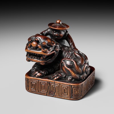 Lot 77 - A VERY RARE WOOD NETSUKE OF A DUTCHMAN WITH SHISHI