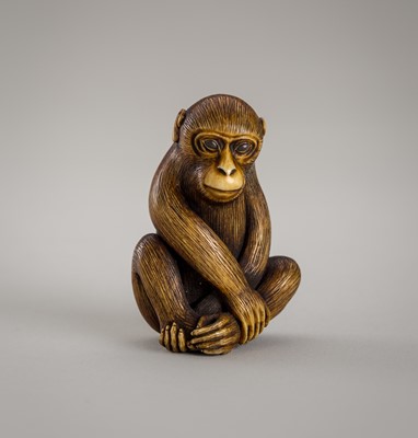 Lot 1370 - KŌGYOKU: A CHARMING IVORY NETSUKE OF A SEATED MONKEY