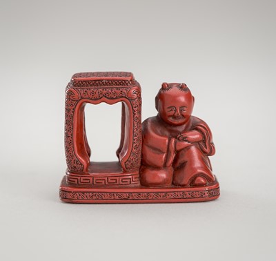 Lot 1214 - A FINE TSUISHU LACQUER NETSUKE OF A KARAKO BESIDE A SIDE TABLE