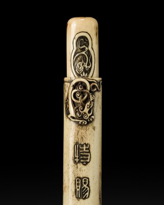 Lot 48 - AN ANTLER KISERUZUTSU WITH A BAKU-SNOUTED RAIN DRAGON