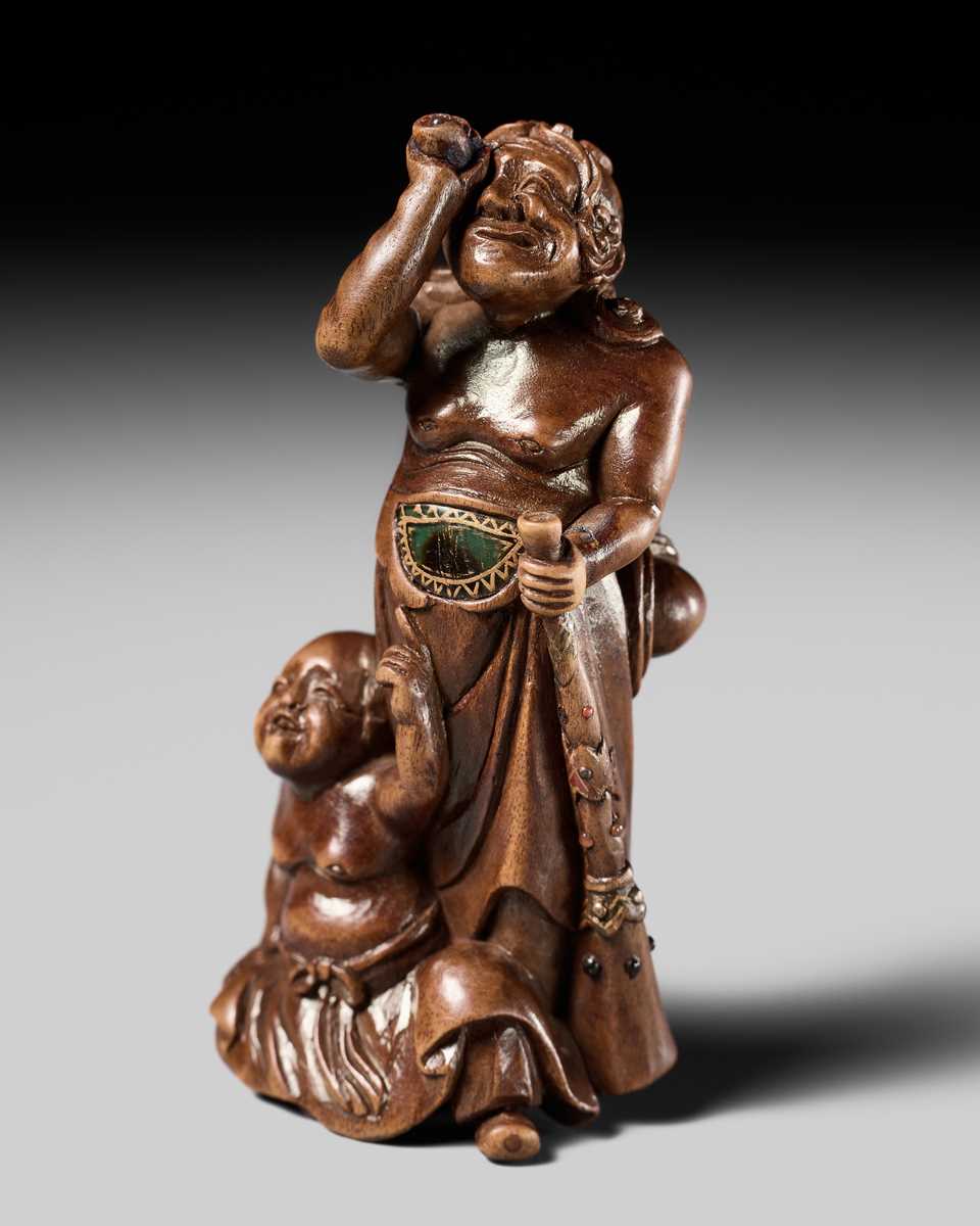 Lot 201 - BAISEN: A RARE WOOD NETSUKE GROUP OF TWO FOREIGN EGG TESTERS