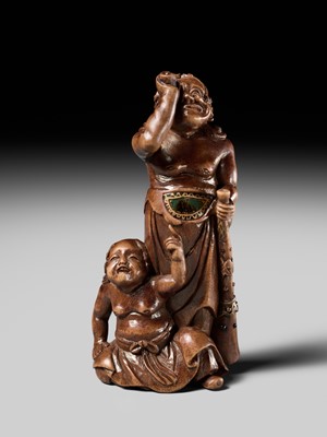 Lot 201 - BAISEN: A RARE WOOD NETSUKE GROUP OF TWO FOREIGN EGG TESTERS