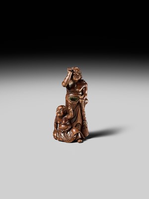 Lot 201 - BAISEN: A RARE WOOD NETSUKE GROUP OF TWO FOREIGN EGG TESTERS