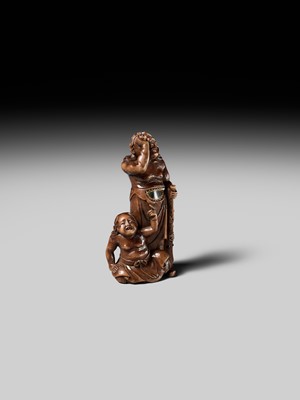 Lot 201 - BAISEN: A RARE WOOD NETSUKE GROUP OF TWO FOREIGN EGG TESTERS