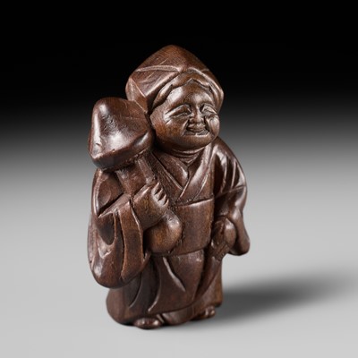 Lot 281 - AN UNUSUAL ITTOBORI WOOD NETSUKE OF OKAME WITH A MUSHROOM