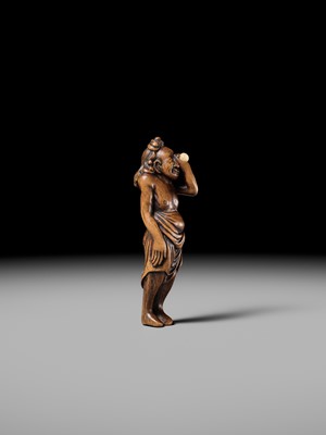 Lot 196 - GESSHO: A SUPERB WOOD NETSUKE OF A FOREIGN EGG TESTER