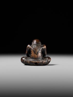 Lot 425 - A RARE WOOD NETSUKE OF AN ONI PARODYING AN EGG TESTER