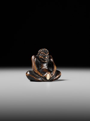 Lot 425 - A RARE WOOD NETSUKE OF AN ONI PARODYING AN EGG TESTER