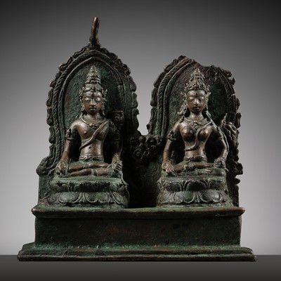 Lot 663 - A RARE BRONZE GROUP DEPICTING AVALOKITESHVARA AND VASUNDHARA, CENTRAL JAVA, 850-950 AD