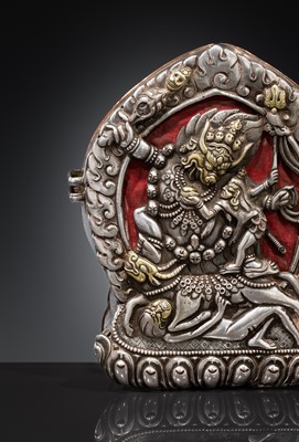 Lot 306 - A PARCEL-GILT SILVER REPOUSSÉ GAU DEPICTING VAJRABHAIRAVA, BHUTAN, 18TH-19TH CENTURY