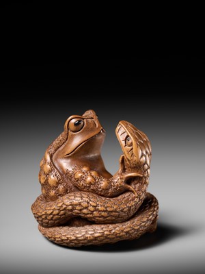 Lot 121 - HARUMITSU: A SUPERB WOOD NETSUKE OF A SNAKE PREYING ON A FROG, SANSUKUMI